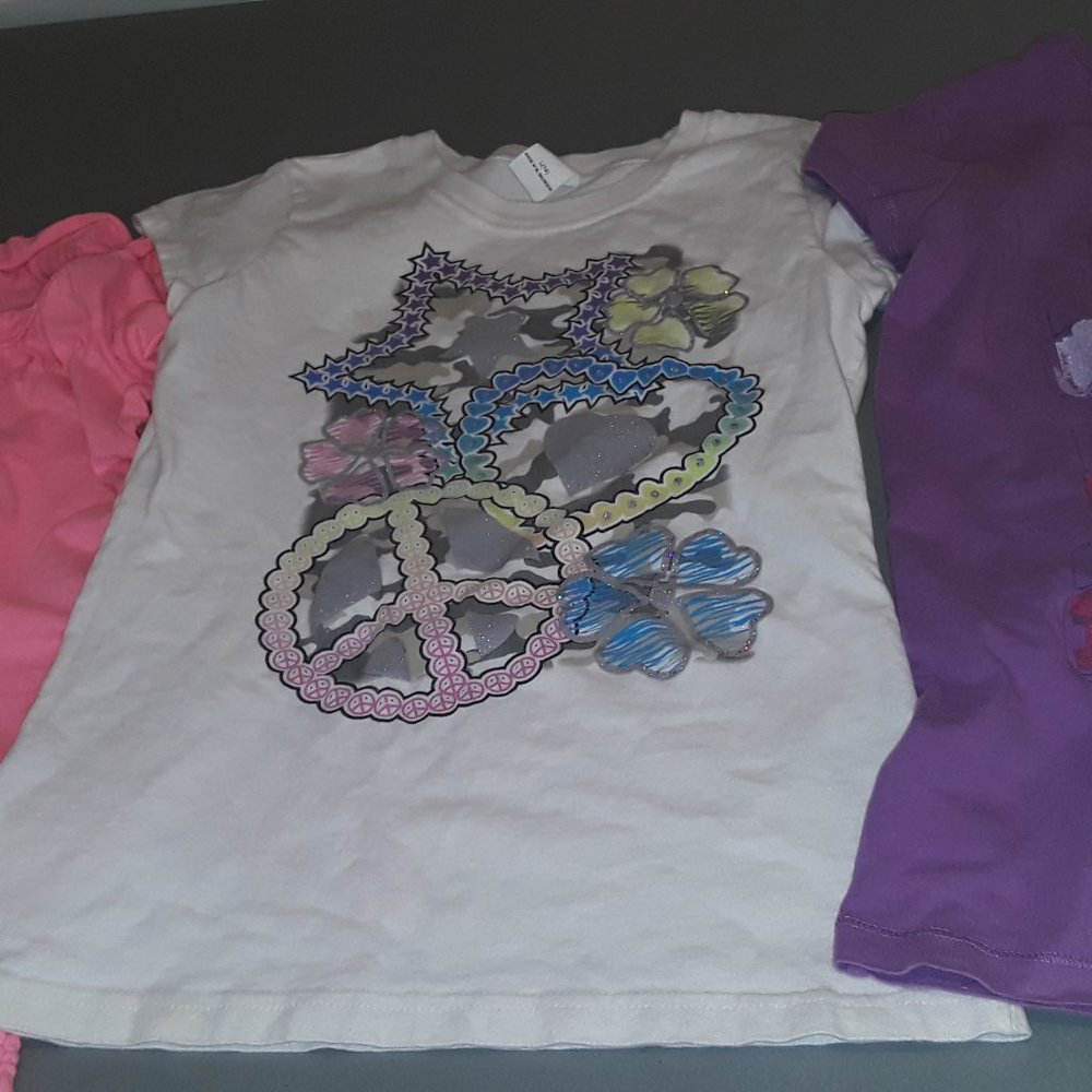 Pink top, purple tee, white tee